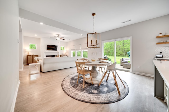 dining room with recessed lighting, visible vents, and light wood-type flooring