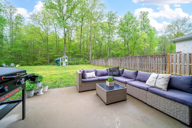 view of patio / terrace with outdoor lounge area, a fenced backyard, and a playground