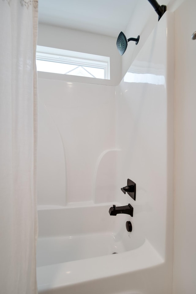 bathroom featuring shower / tub combo with curtain