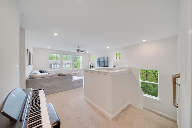 corridor featuring recessed lighting, an upstairs landing, and carpet floors
