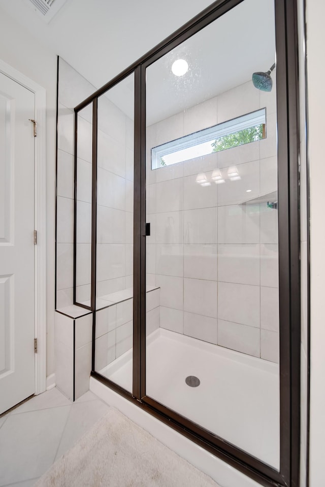 full bath featuring visible vents, a shower stall, and tile patterned flooring