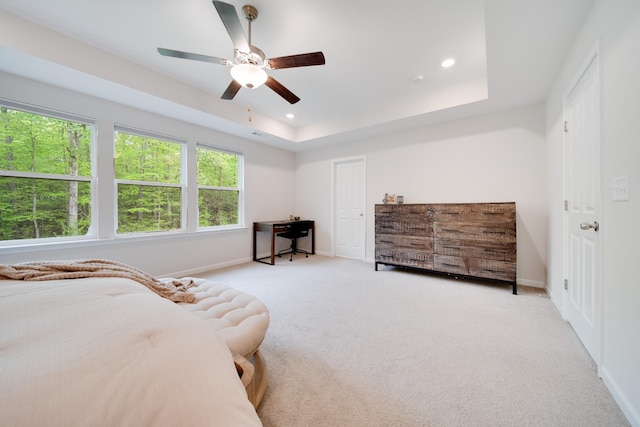 bedroom featuring recessed lighting, carpet, ceiling fan, baseboards, and a raised ceiling