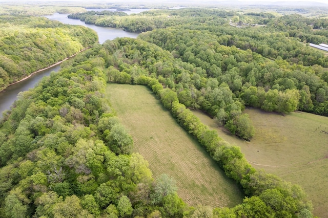 drone / aerial view featuring a forest view, a water view, and a rural view