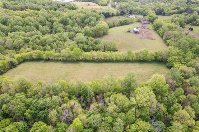 bird's eye view featuring a forest view and a rural view