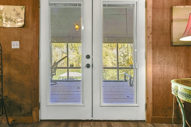 doorway to outside featuring french doors and wood finished floors