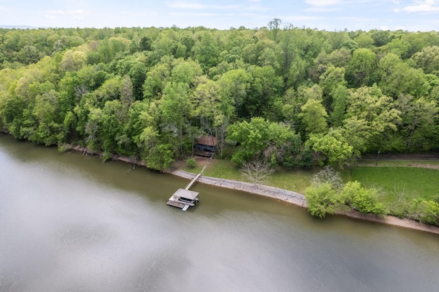 aerial view with a forest view and a water view