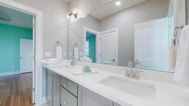 6412B Edsel Dr, Nashville, TN 37209 - full bathroom featuring double vanity, wood finished floors, baseboards, and recessed lighting