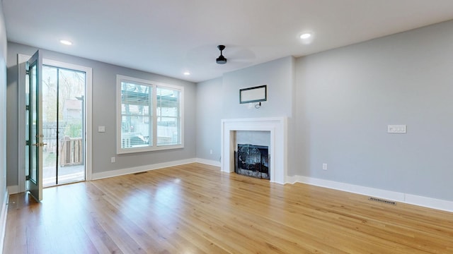 6412B Edsel Dr, Nashville, TN 37209 - unfurnished living room with light wood finished floors, baseboards, recessed lighting, and a fireplace