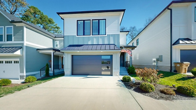 6412B Edsel Dr, Nashville, TN 37209 - contemporary house featuring board and batten siding, a garage, a standing seam roof, driveway, and metal roof