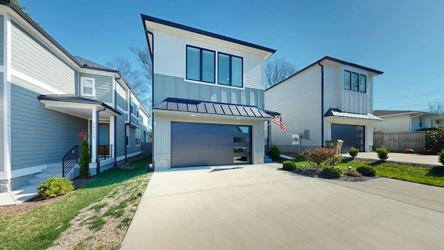 6412B Edsel Dr, Nashville, TN 37209 - modern home with board and batten siding, a garage, a standing seam roof, concrete driveway, and fence