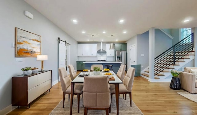 6412B Edsel Dr, Nashville, TN 37209 - dining space with a barn door, stairway, light wood finished floors, recessed lighting, and baseboards
