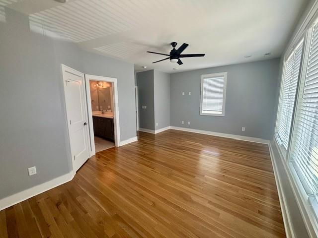 6412B Edsel Dr, Nashville, TN 37209 - unfurnished bedroom featuring multiple windows and baseboards