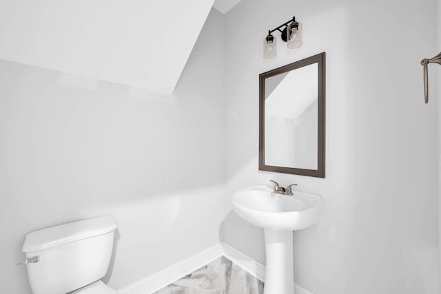 350 Galway Dr, Clarksville, TN 37042 - bathroom featuring baseboards, toilet, and marble look tiles