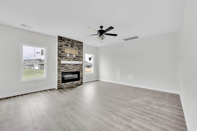 350 Galway Dr, Clarksville, TN 37042 - unfurnished living room with baseboards, a ceiling fan, wood finished floors, and a fireplace