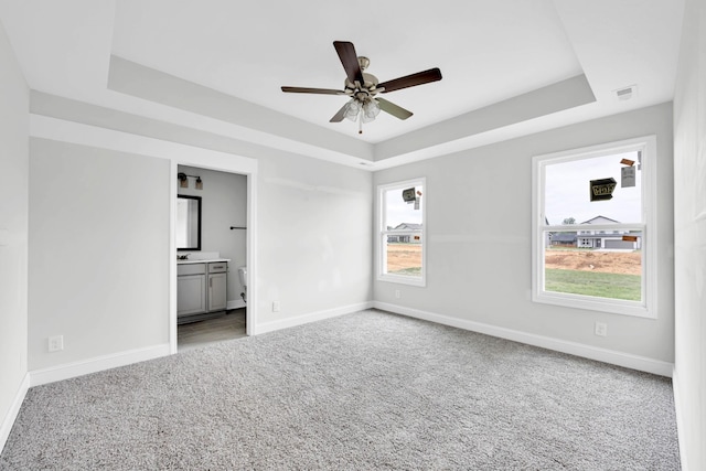 358 Galway Dr, Clarksville, TN 37042 - carpeted spare room with a tray ceiling and a ceiling fan