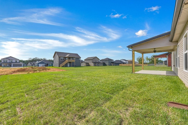 358 Galway Dr, Clarksville, TN 37042 - view of green lawn with ceiling fan, a residential view, and a patio