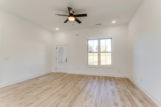 unfurnished room with light wood finished floors, baseboards, visible vents, recessed lighting, and a ceiling fan