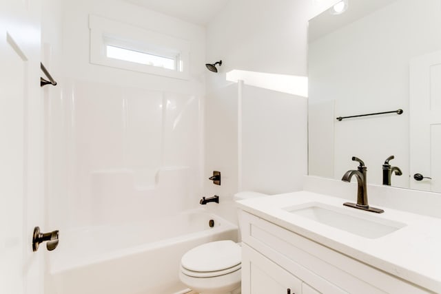 full bath featuring tub / shower combination, vanity, and toilet