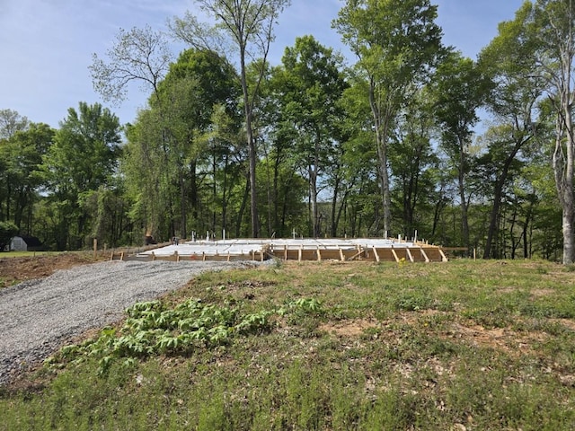 exterior space with a wooded view