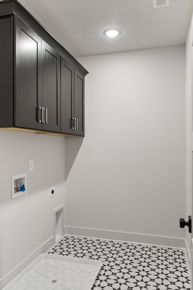 430 Mercomatic Dr, Nashville, TN 37209 - clothes washing area with hookup for an electric dryer, visible vents, baseboards, recessed lighting, and cabinet space