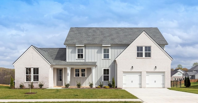 7408 Black Fox Dr, Fairview, TN 37062 - modern farmhouse style home featuring board and batten siding, an attached garage, brick siding, and driveway