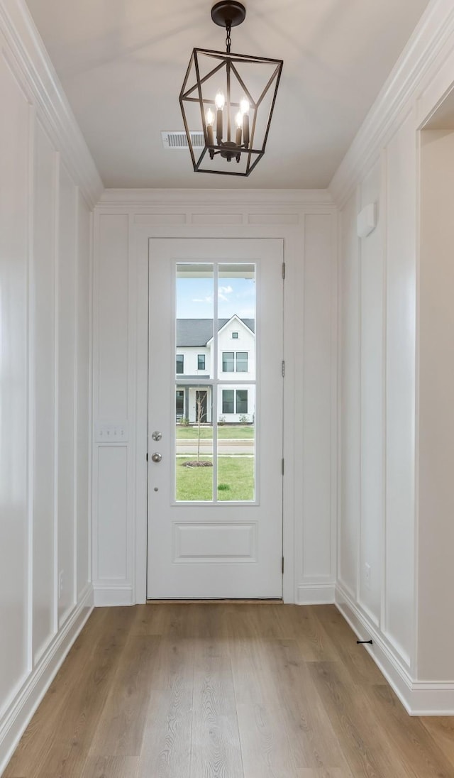 7408 Black Fox Dr, Fairview, TN 37062 - entryway with a chandelier, a decorative wall, and light wood finished floors