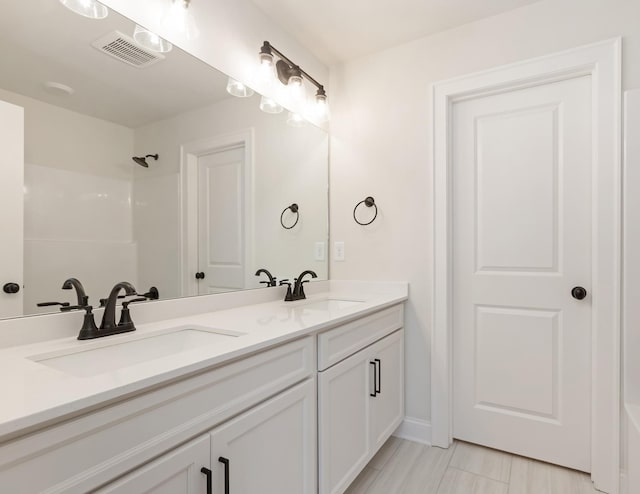 7408 Black Fox Dr, Fairview, TN 37062 - full bath with walk in shower, a sink, visible vents, and double vanity