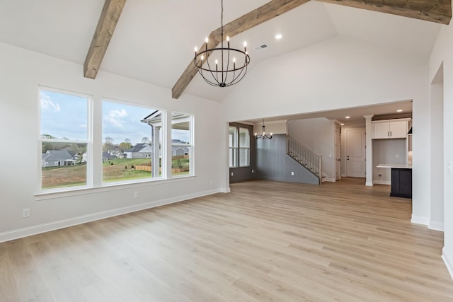 7408 Black Fox Dr, Fairview, TN 37062 - unfurnished living room with beamed ceiling, light wood-style flooring, high vaulted ceiling, and a chandelier