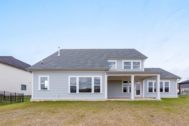 7408 Black Fox Dr, Fairview, TN 37062 - back of house featuring fence, roof with shingles, and a yard
