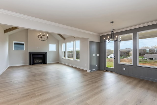 7408 Black Fox Dr, Fairview, TN 37062 - unfurnished living room with baseboards, an inviting chandelier, light wood-style floors, lofted ceiling, and a fireplace