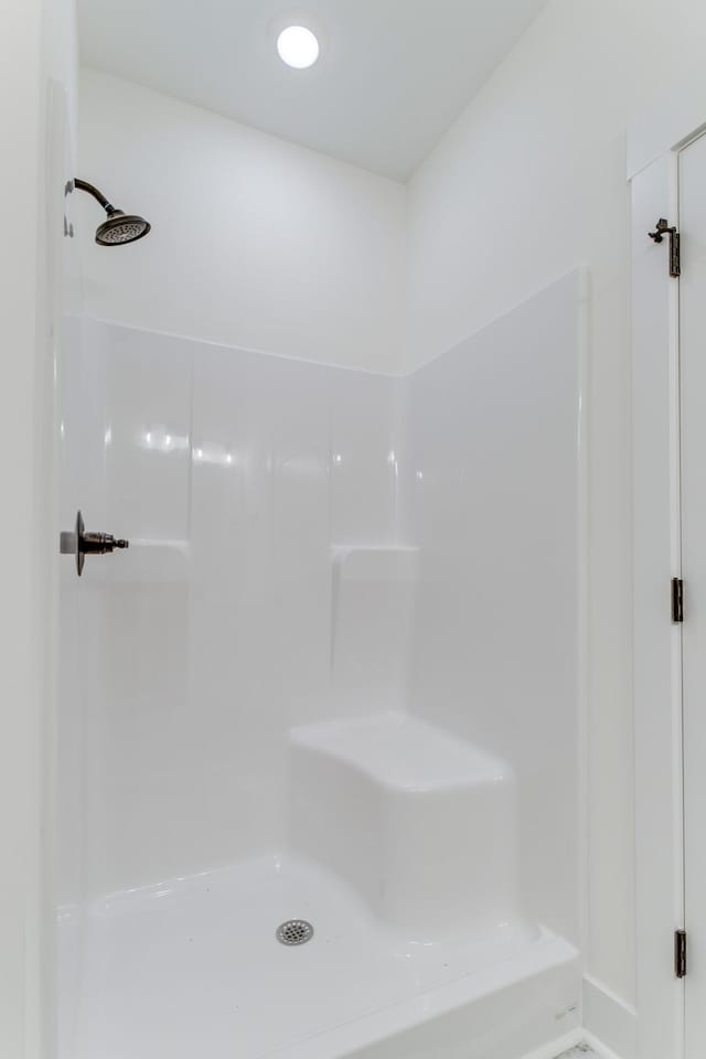 full bathroom featuring walk in shower