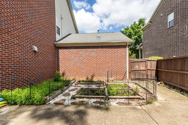 view of yard featuring a garden and fence