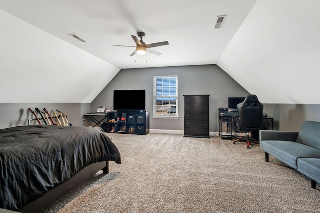 bedroom with lofted ceiling, visible vents, and carpet