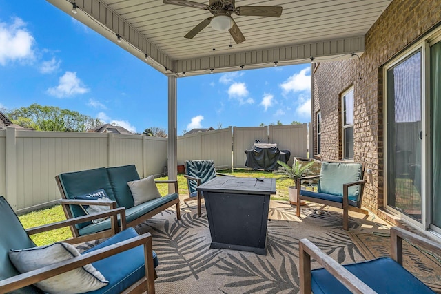 view of patio / terrace with ceiling fan, a fenced backyard, and an outdoor hangout area