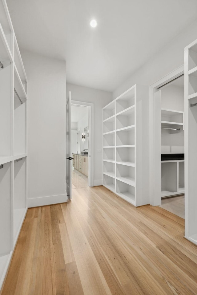 spacious closet featuring wood finished floors