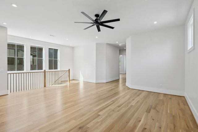 unfurnished room with plenty of natural light, recessed lighting, and light wood-style flooring