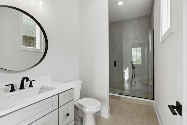 full bath with tile patterned flooring, toilet, vanity, baseboards, and a stall shower