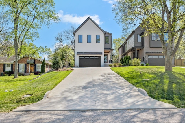 contemporary home featuring an attached garage, a front yard, stucco siding, and driveway
