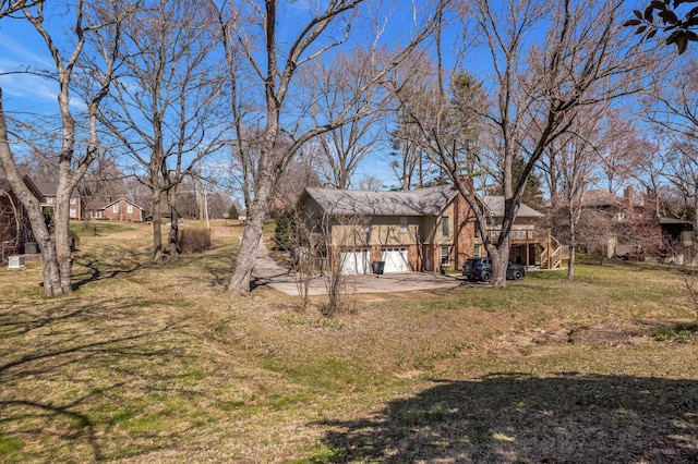 8309 Alamo Rd, Brentwood, TN 37027 - view of yard featuring driveway, a deck, stairs, and a garage