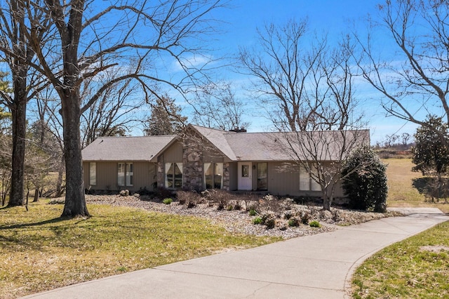 8309 Alamo Rd, Brentwood, TN 37027 - view of front facade featuring a chimney and a front yard