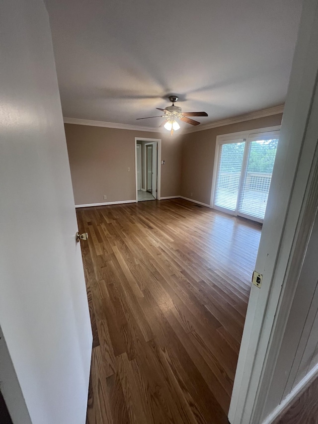 8309 Alamo Rd, Brentwood, TN 37027 - spare room with ceiling fan, baseboards, crown molding, and wood finished floors