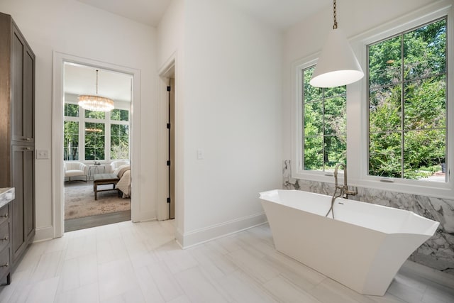 2811 Tyne Blvd, Nashville, TN 37215 - ensuite bathroom featuring vanity, ensuite bath, a healthy amount of sunlight, and a freestanding tub
