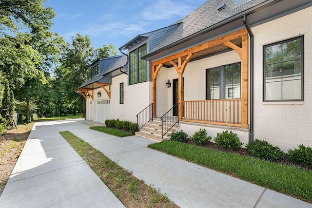 2811 Tyne Blvd, Nashville, TN 37215 - exterior space with brick siding, driveway, a garage, and covered porch