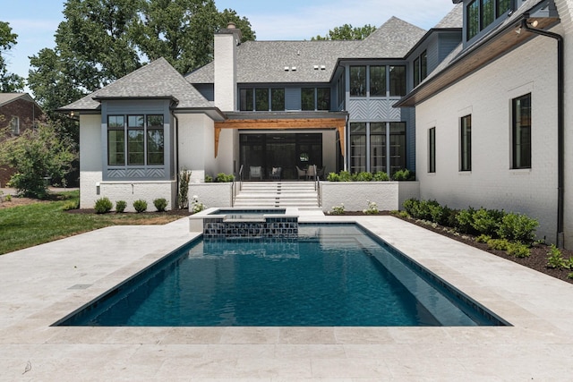 2811 Tyne Blvd, Nashville, TN 37215 - back of house featuring a chimney, a shingled roof, a patio area, brick siding, and a pool with connected hot tub