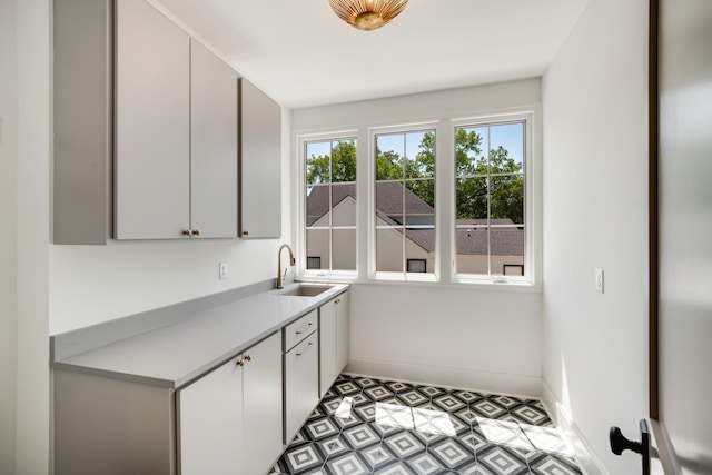 2811 Tyne Blvd, Nashville, TN 37215 - laundry area with light floors, baseboards, and a sink