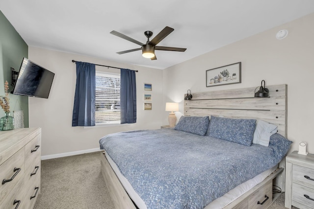 carpeted bedroom featuring a ceiling fan and baseboards