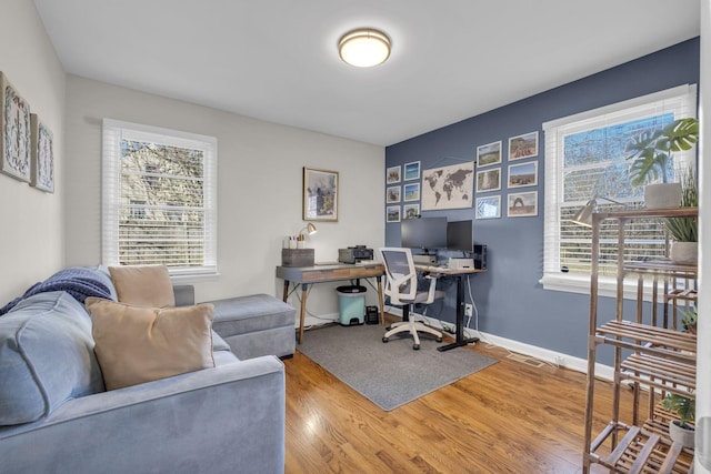 home office with wood finished floors and baseboards