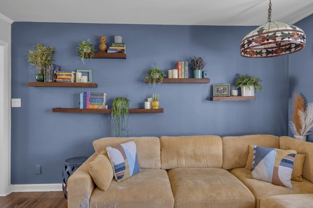 living room with wood finished floors and baseboards