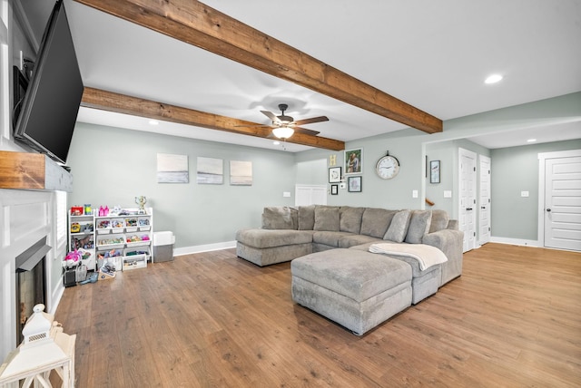 237 Wade Hampton Ln, Clarksville, TN 37040 - living area featuring beam ceiling, baseboards, a fireplace, and wood finished floors