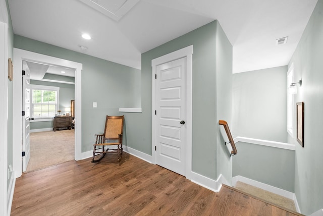 237 Wade Hampton Ln, Clarksville, TN 37040 - sitting room featuring baseboards, an upstairs landing, wood finished floors, and visible vents